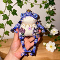 Purple Flower &amp; Crowned Chick Toad Duchess – Hand-Knitted Blue-Violet Figurine with Gold Crown, Pearl Necklace, Lavender Bouquet &amp; Crystal Chick with Heart Gem