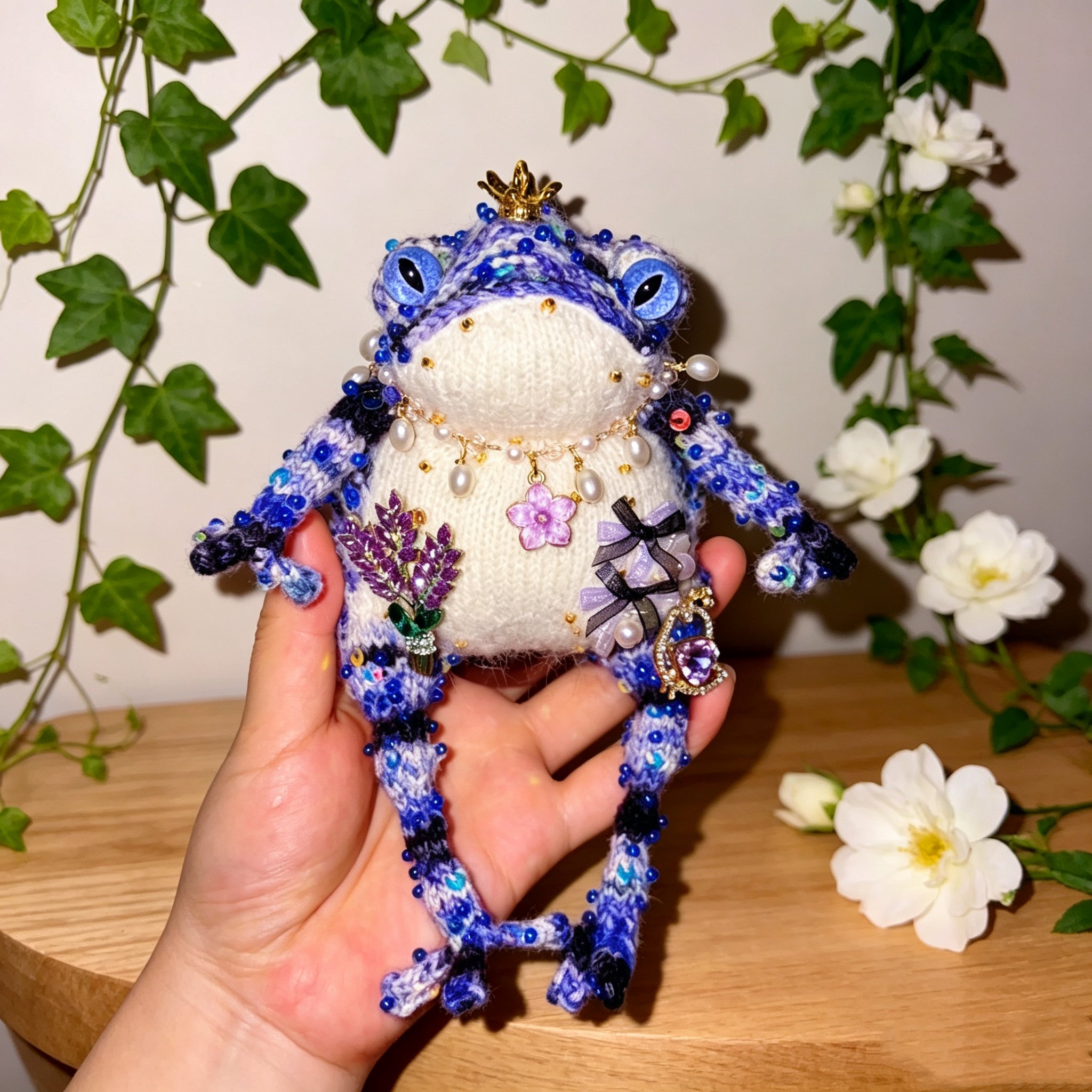Purple Flower &amp; Crowned Chick Toad Duchess – Hand-Knitted Blue-Violet Figurine with Gold Crown, Pearl Necklace, Lavender Bouquet &amp; Crystal Chick with Heart Gem