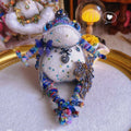 Silver Crown Blue Toad – Hand-Knitted Figurine with Black Heart Pendant, Purple Butterfly, Bronze Wing Brooch &amp; Beaded Limbs | The Third Space