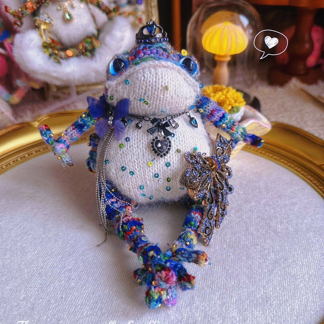 Silver Crown Blue Toad – Hand-Knitted Figurine with Black Heart Pendant, Purple Butterfly, Bronze Wing Brooch &amp; Beaded Limbs | The Third Space
