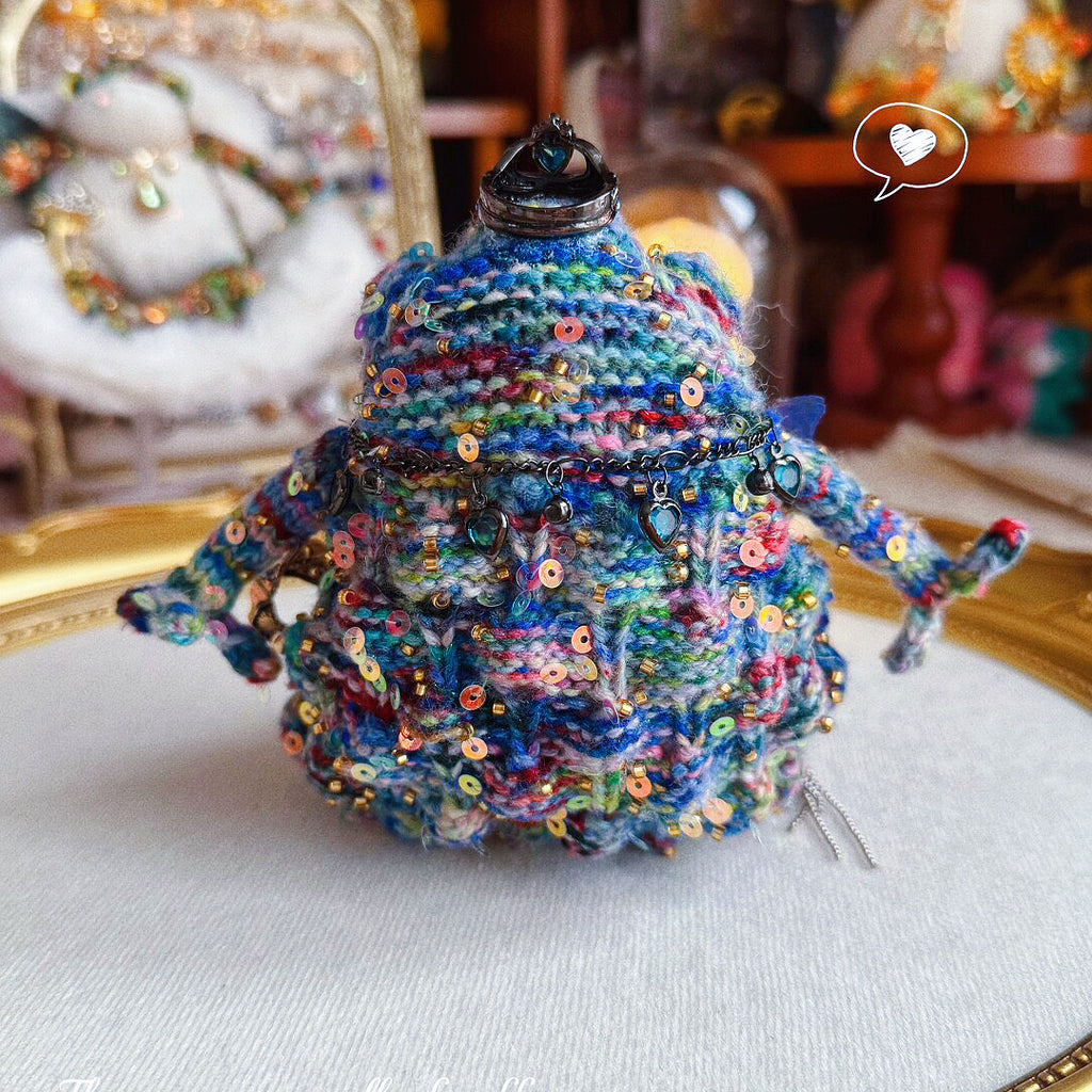 Silver Crown Blue Toad – Hand-Knitted Figurine with Black Heart Pendant, Purple Butterfly, Bronze Wing Brooch &amp; Beaded Limbs | The Third Space