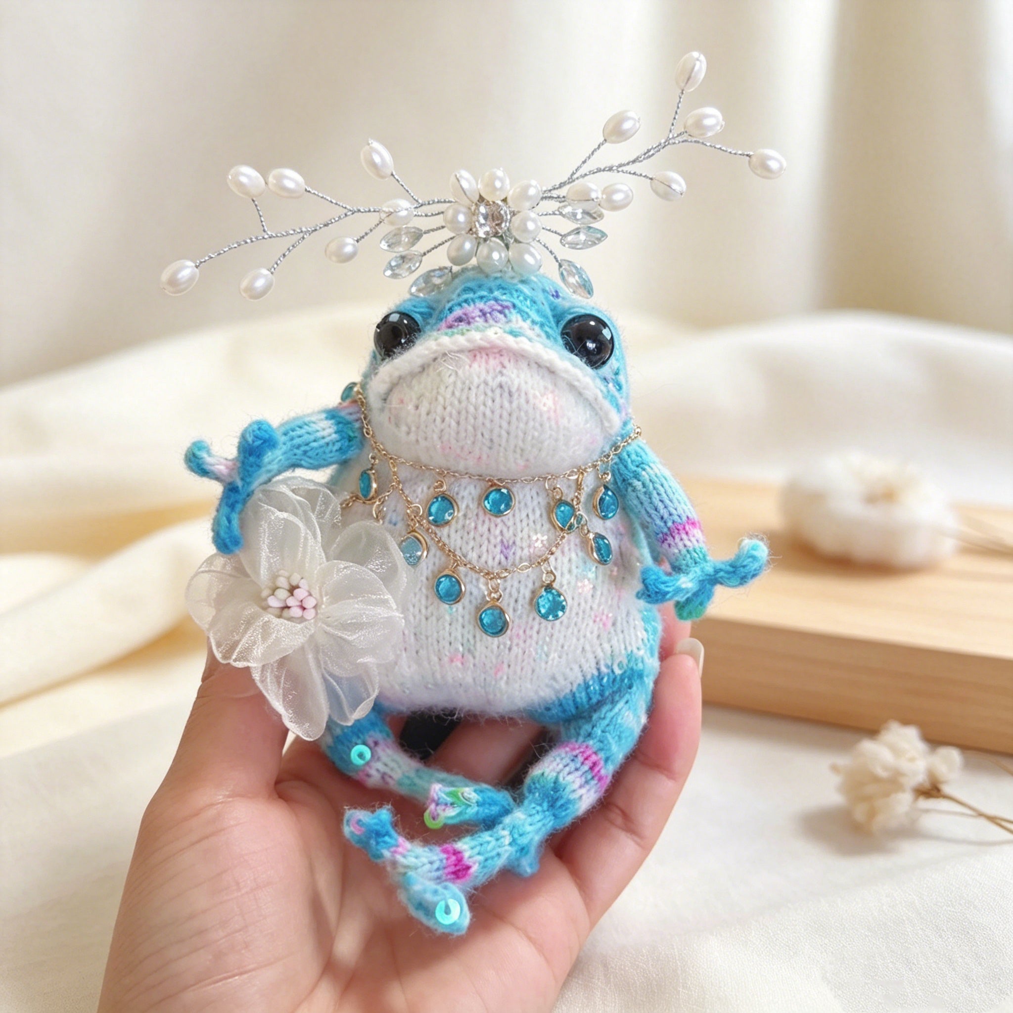 Blue Crystal Toad Princess – Hand-Knitted Dreamy Figurine with Silver Pearl Crown, Layered Gold Crystal Necklace, Blue Gem Pendants &amp; White Tulle Flower | The Third Space