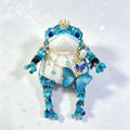 Royal Court Toad Duo – Hand-Knitted Blue Toads in Parent &amp; Child Sizes with Gold Crowns, Pearl Accents, Crystal Butterflies &amp; Layered Gem Necklaces | The Third Space