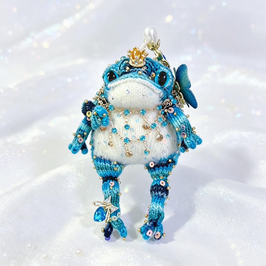 Royal Court Toad Duo – Hand-Knitted Blue Toads in Parent &amp; Child Sizes with Gold Crowns, Pearl Accents, Crystal Butterflies &amp; Layered Gem Necklaces | The Third Space