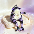 Sapphire-Eyed Mystic Toad – Hand-Knitted Figurine with Silver Crown, Purple Heart Gem, Pearl Necklace, Golden Bee Pendant &amp; Sequin Accents | The Third Space