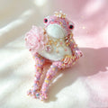 The Princess Toad Who Carried a Ruby Heart – Hand-Knitted Pink Figurine with Pearl Crystal Crown, Heart Pendant Necklace, Ladybug Brooch, Tulle Flower &amp; Sequin-Starred Limbs | The Third Space