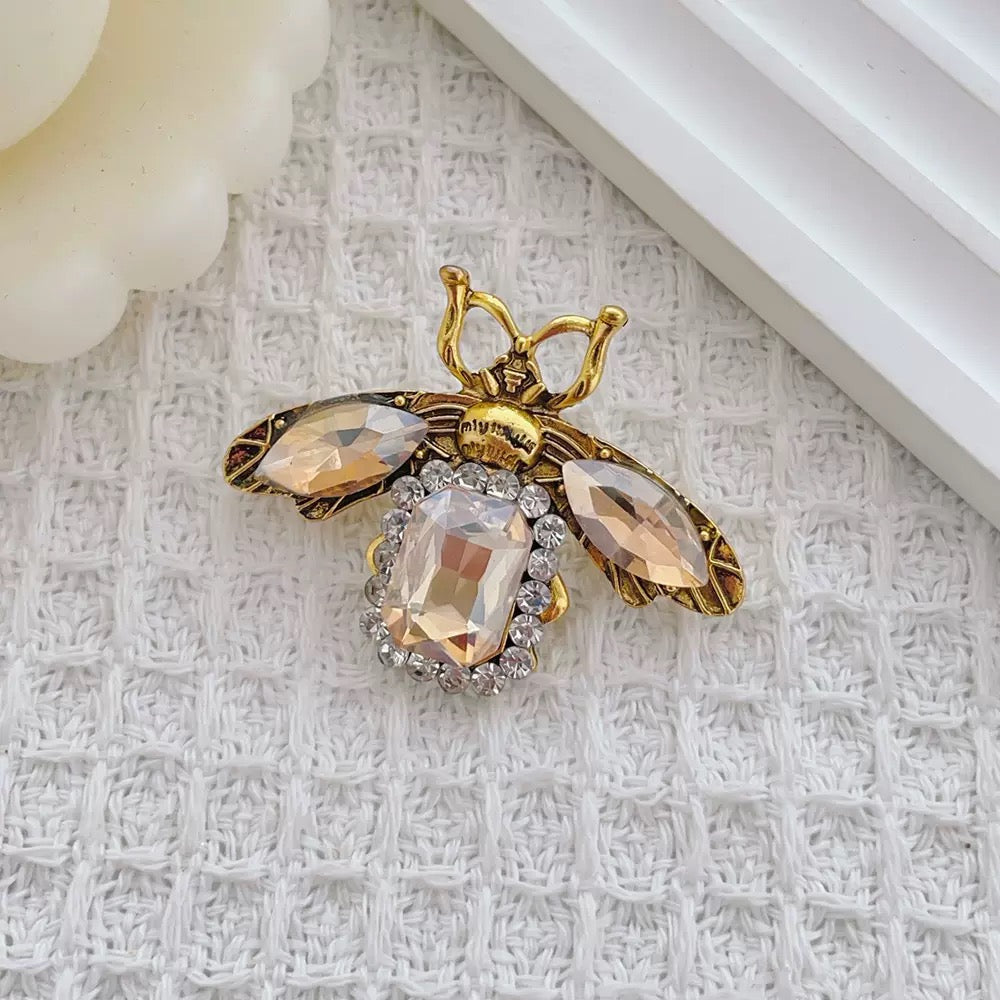 Cosmic Bee Saturn Toad – Handknit Cream &amp; Gold Figurine with Crystal-Winged Bee, Planetary Pendant &amp; Sequin Stardust