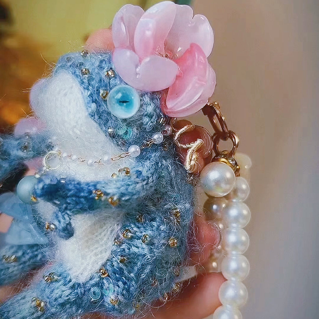 The Flower-Crowned Forest Prince – Hand-Knitted Miniature Toad Charm with Gold Crown, Blue Glass Eyes, Pink Blossoms, Pearl Necklace &amp; Sequin-Toed Limbs | The Third Space