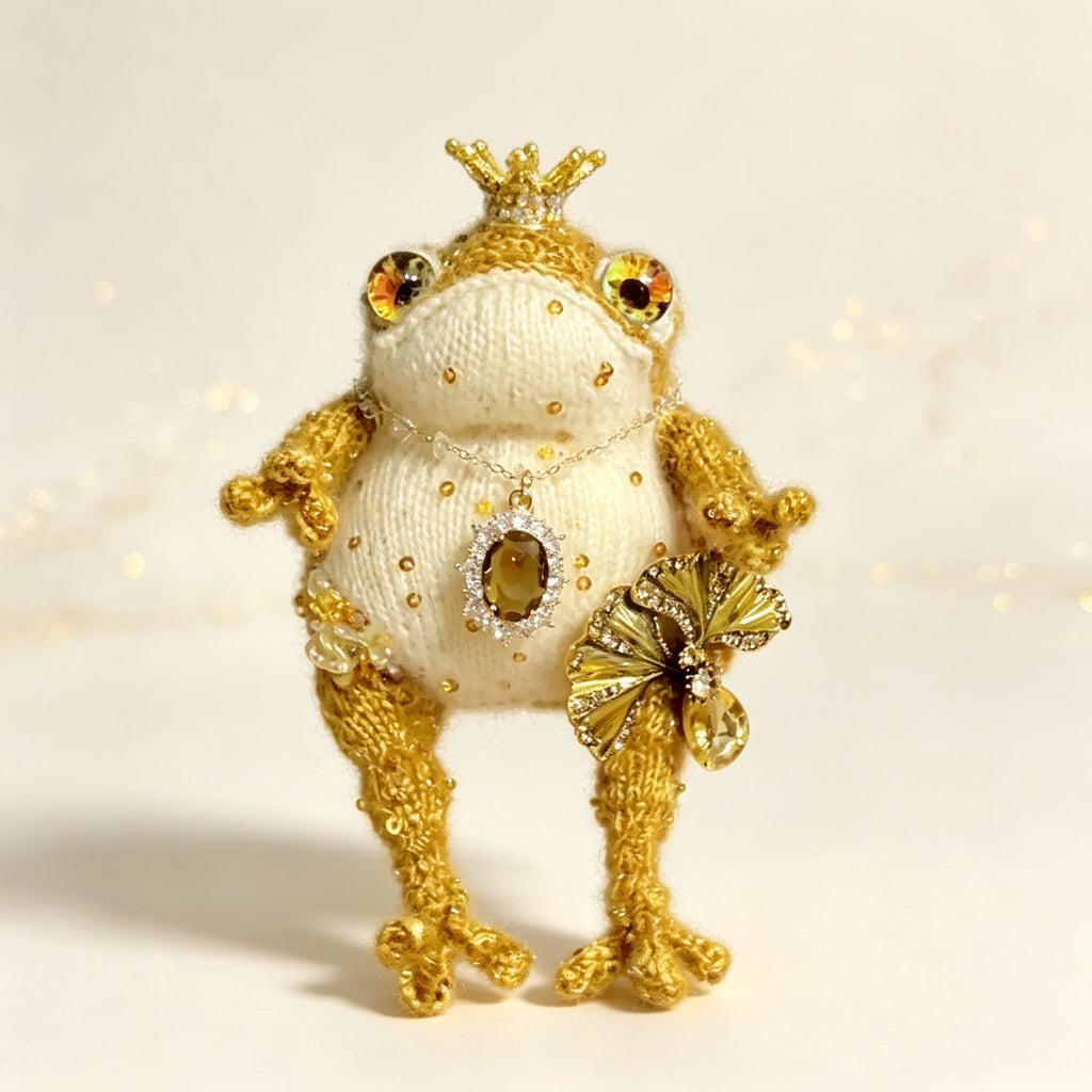 The Golden Frog Prince – Hand-Knitted Royal Charm with Mini Crown, Jewel Eyes, Gemstone Belly, Golden Limbs, Bow Accent &amp; Hanging Loop | The Third Space