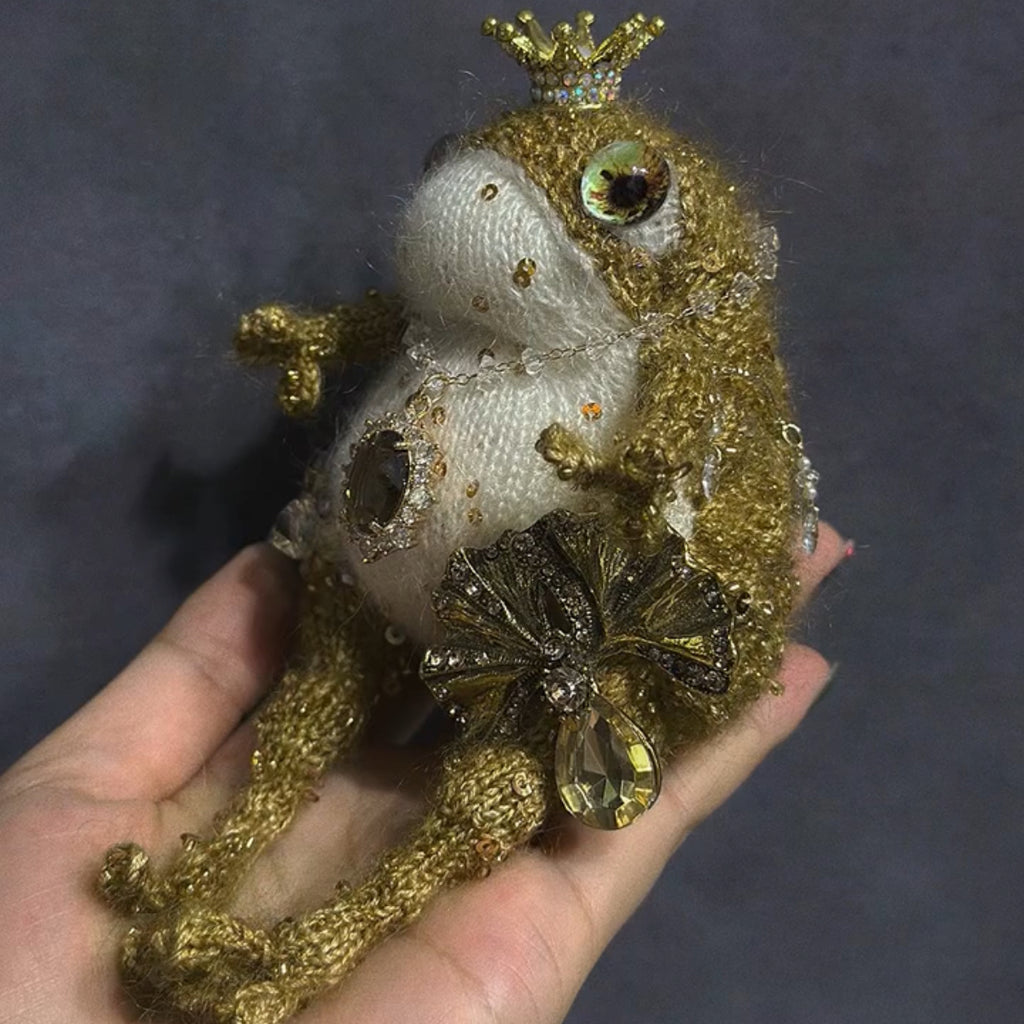 The Golden Frog Prince – Hand-Knitted Royal Charm with Mini Crown, Jewel Eyes, Gemstone Belly, Golden Limbs, Bow Accent &amp; Hanging Loop | The Third Space