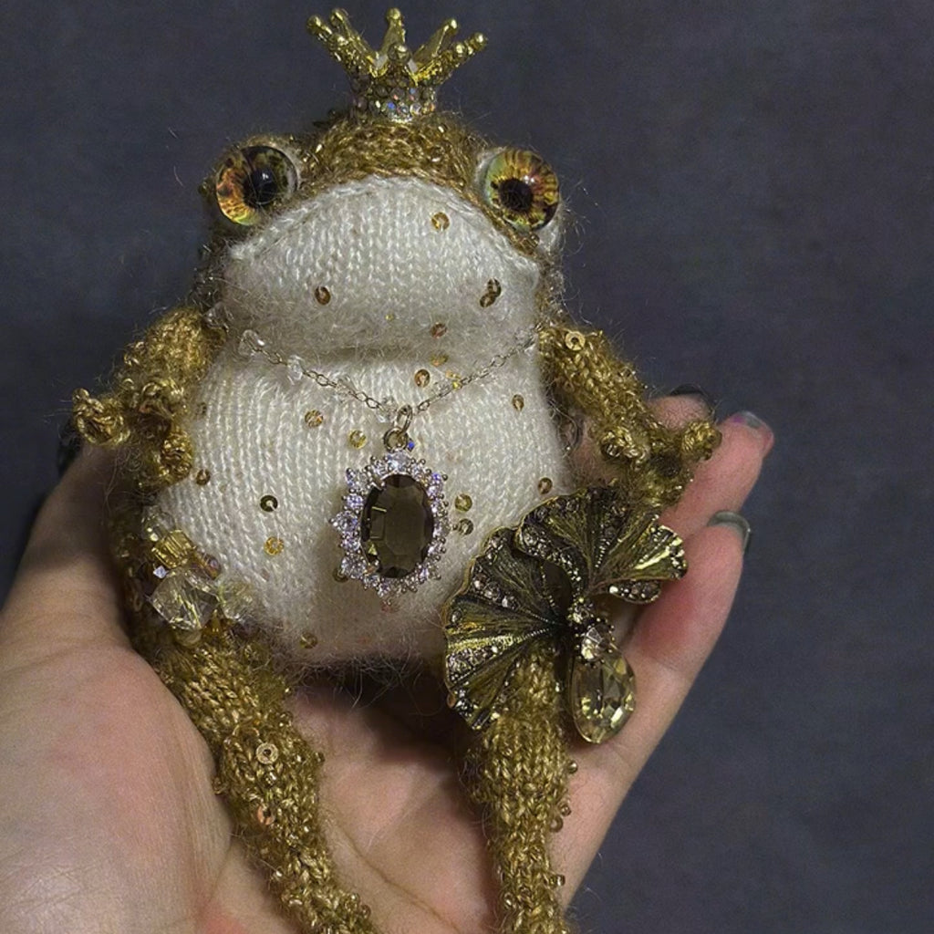 The Golden Frog Prince – Hand-Knitted Royal Charm with Mini Crown, Jewel Eyes, Gemstone Belly, Golden Limbs, Bow Accent &amp; Hanging Loop | The Third Space