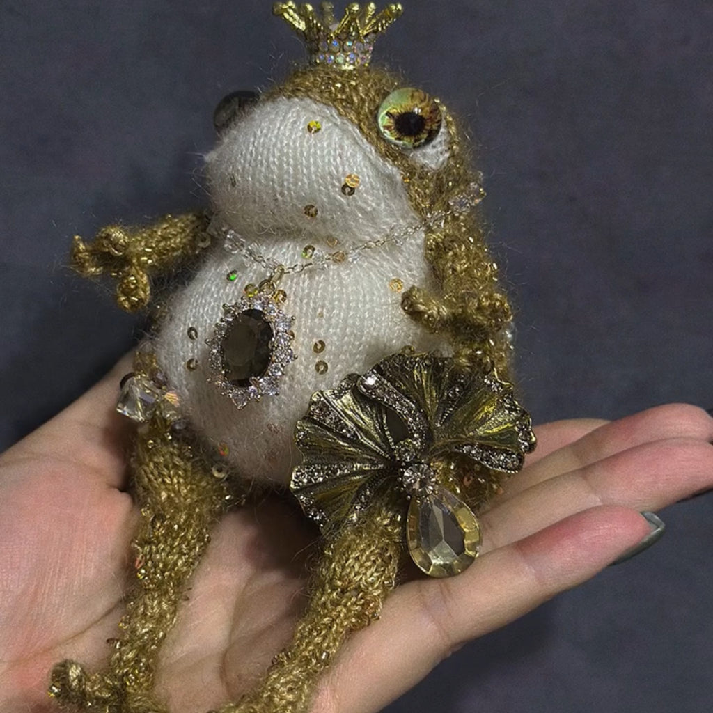The Golden Frog Prince – Hand-Knitted Royal Charm with Mini Crown, Jewel Eyes, Gemstone Belly, Golden Limbs, Bow Accent &amp; Hanging Loop | The Third Space