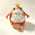 The Crowned Jewel King – Hand-Knitted Royal Toad Figurine with Gold Crown, Layered Jewel Necklaces, Sequin-Embellished Body, Beaded Limbs &amp; Plump Creamy Belly | The Third Space