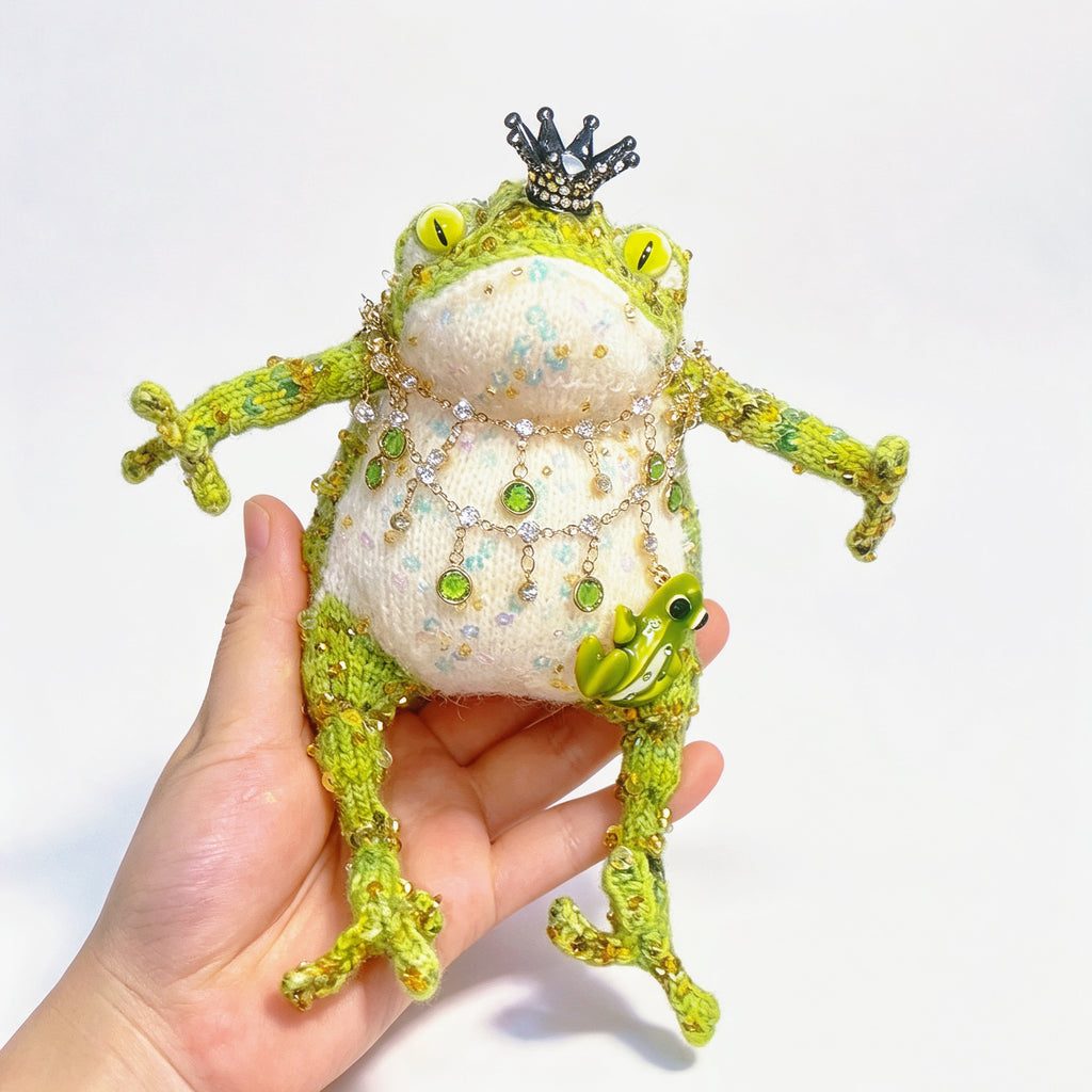 The Crowned Royal Lovers – Set of 2 Hand-Knitted Bejeweled Toads: Pink Princess with Crystal Crown, Star-Moon Charms &amp; Golden Fan, Green Prince with Black Crystal Crown, Gold Chains &amp; Tiny Frog Companion | The Third Space