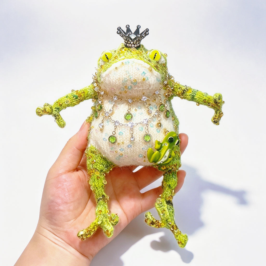 The Crowned Royal Lovers – Set of 2 Hand-Knitted Bejeweled Toads: Pink Princess with Crystal Crown, Star-Moon Charms &amp; Golden Fan, Green Prince with Black Crystal Crown, Gold Chains &amp; Tiny Frog Companion | The Third Space