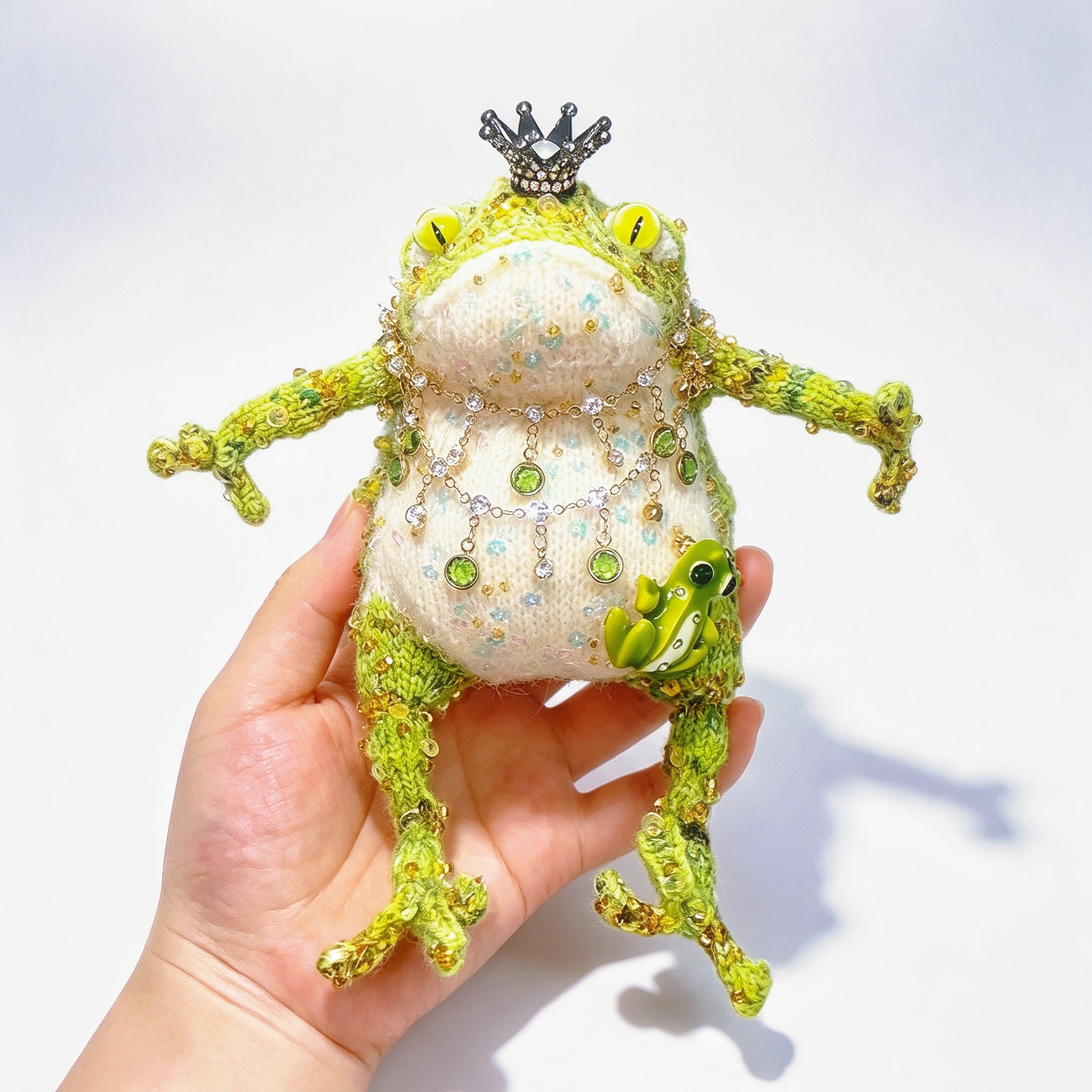 The Crowned Royal Lovers – Set of 2 Hand-Knitted Bejeweled Toads: Pink Princess with Crystal Crown, Star-Moon Charms &amp; Golden Fan, Green Prince with Black Crystal Crown, Gold Chains &amp; Tiny Frog Companion | The Third Space
