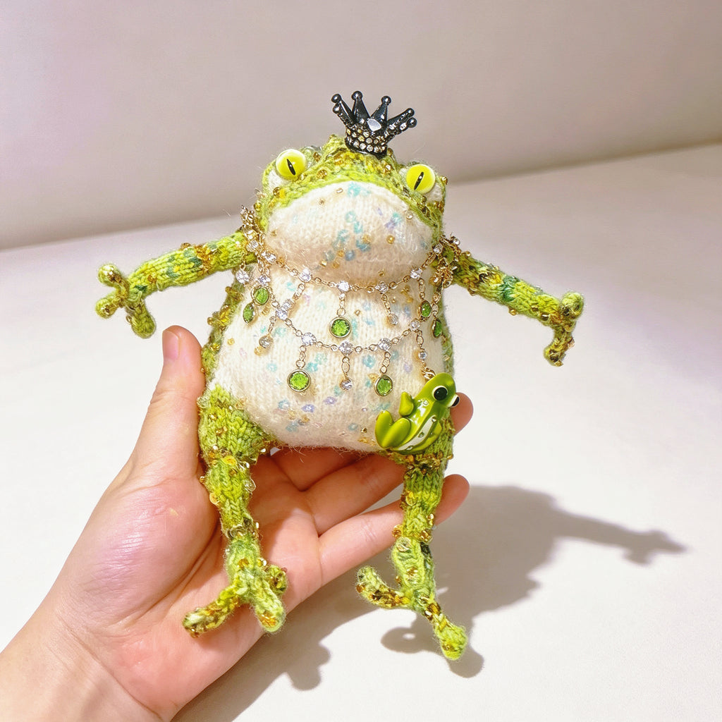 The Crowned Royal Lovers – Set of 2 Hand-Knitted Bejeweled Toads: Pink Princess with Crystal Crown, Star-Moon Charms &amp; Golden Fan, Green Prince with Black Crystal Crown, Gold Chains &amp; Tiny Frog Companion | The Third Space