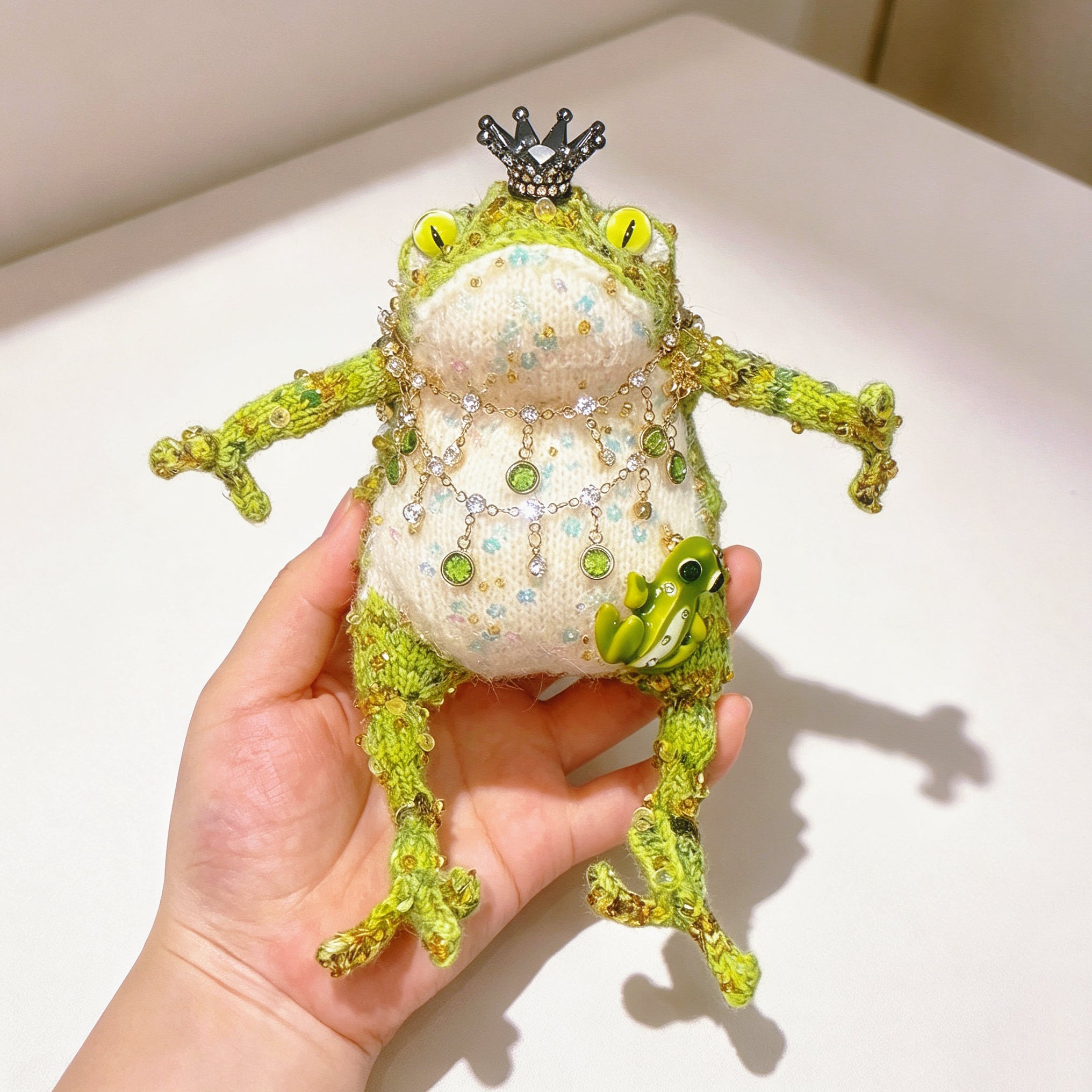 The Crowned Royal Lovers – Set of 2 Hand-Knitted Bejeweled Toads: Pink Princess with Crystal Crown, Star-Moon Charms &amp; Golden Fan, Green Prince with Black Crystal Crown, Gold Chains &amp; Tiny Frog Companion | The Third Space