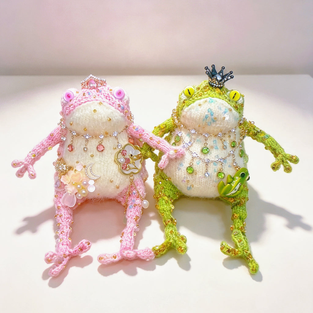 The Crowned Royal Lovers – Set of 2 Hand-Knitted Bejeweled Toads: Pink Princess with Crystal Crown, Star-Moon Charms &amp; Golden Fan, Green Prince with Black Crystal Crown, Gold Chains &amp; Tiny Frog Companion | The Third Space