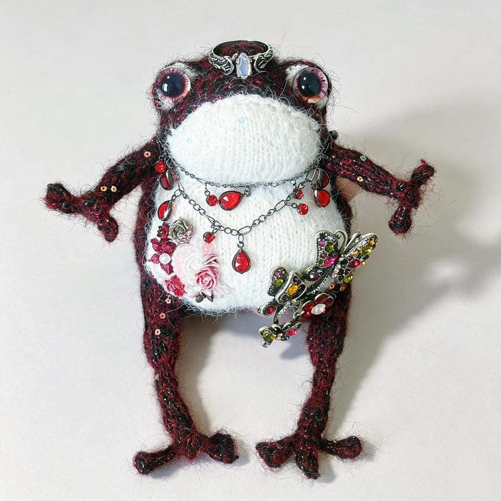 The Gothic Jewel Toad – Hand-Knitted Figurine in Deep Red &amp; Black Sparkle Yarn, Silver Crown, Ruby Teardrop Necklace, Crystal Butterfly Brooch &amp; Embroidered Flowers | The Third Space